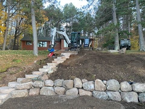 Lakefront Shoreline Transformation with Boulder Accents image